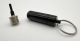 B929_4 - Keychain Capsule (black) with Mini Spinning Top