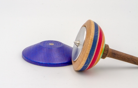 KV180 - Wooden spinning top with metal inlay