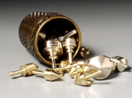 B886 - A thimbleful of gyroscopic silver, aluminum, and brass. 5-7 on a scale of 0 to 7.